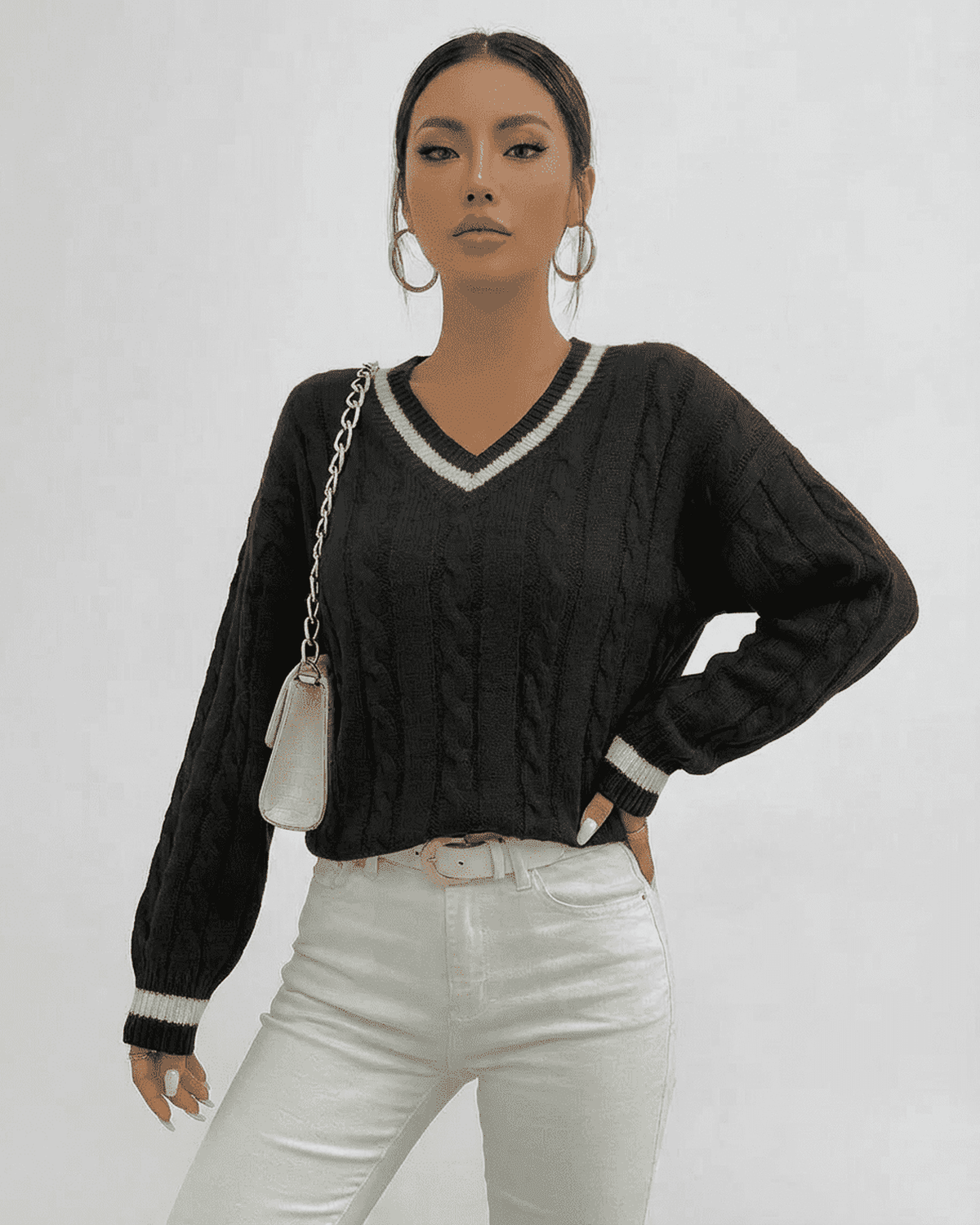 Verona Sweater by Lauven featuring cable knit design and V-neck silhouette, perfect for stylish layering.