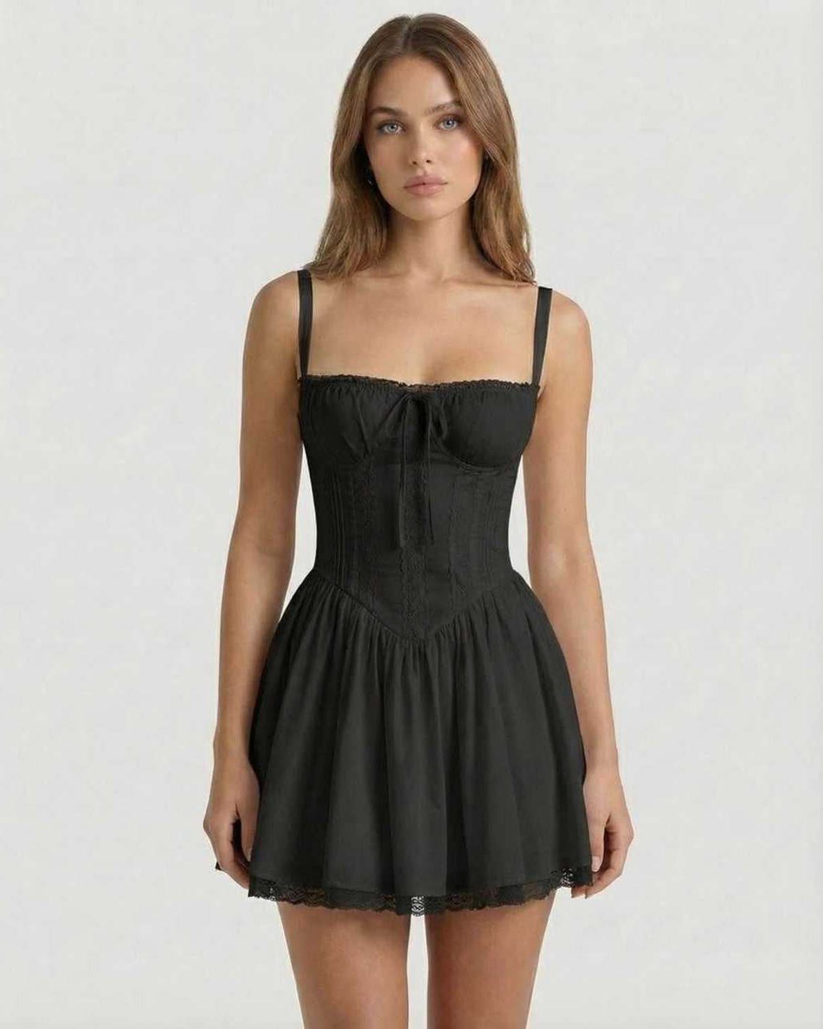 Vesper Mini Dress featuring a black corset style, lace trim, and A-line skirt for a sophisticated look by Lauven.