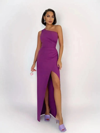 Violet Mirage Maxi Dress featuring a one-shoulder design, thigh-high slit, and sculpted silhouette in vibrant purple.