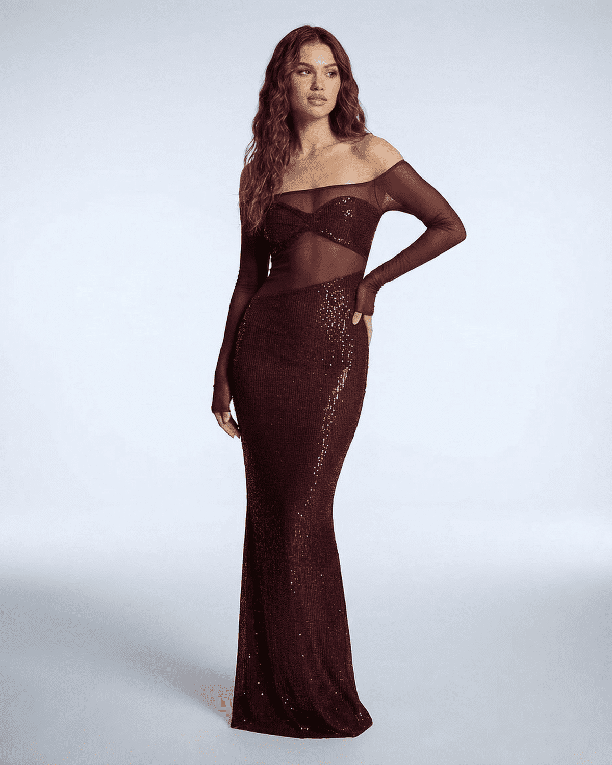 Lauven Virella Maxi Dress in deep red sequins and mesh, featuring a stunning off-shoulder neckline and figure-hugging silhouette.