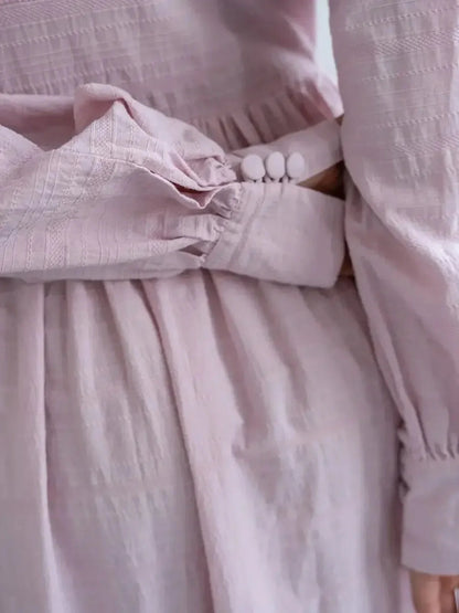 Close-up of the Willow Grace Maxi Dress in soft pink, highlighting the delicate texture and button-front closure.