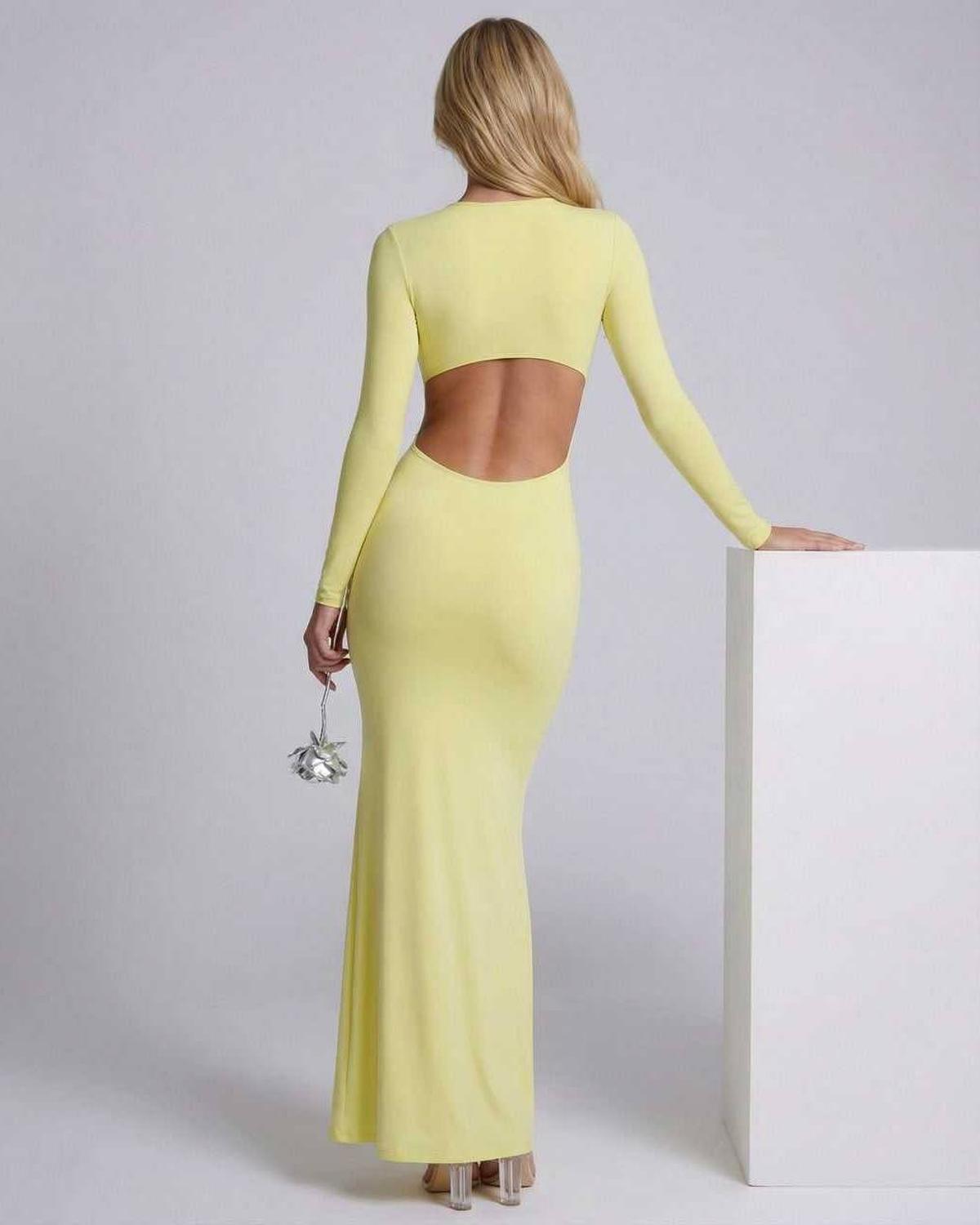 Zahara Maxi Dress featuring a ruffle V-neck, open back, and sleek bodycon silhouette in stylish yellow by Lauven.
