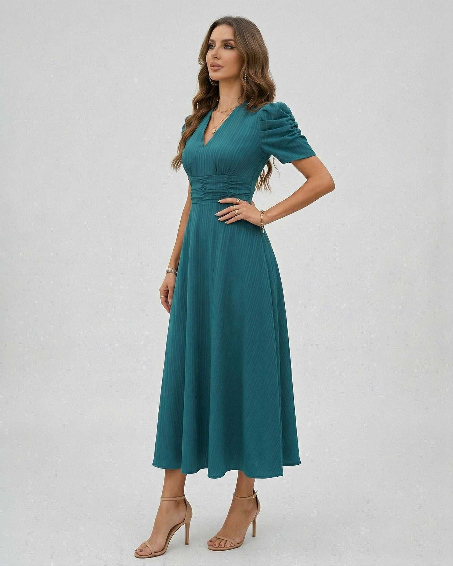Zahara Midi Dress in teal, featuring sleeves and a flattering silhouette, perfect for wedding guests and cocktail events by Lauven.