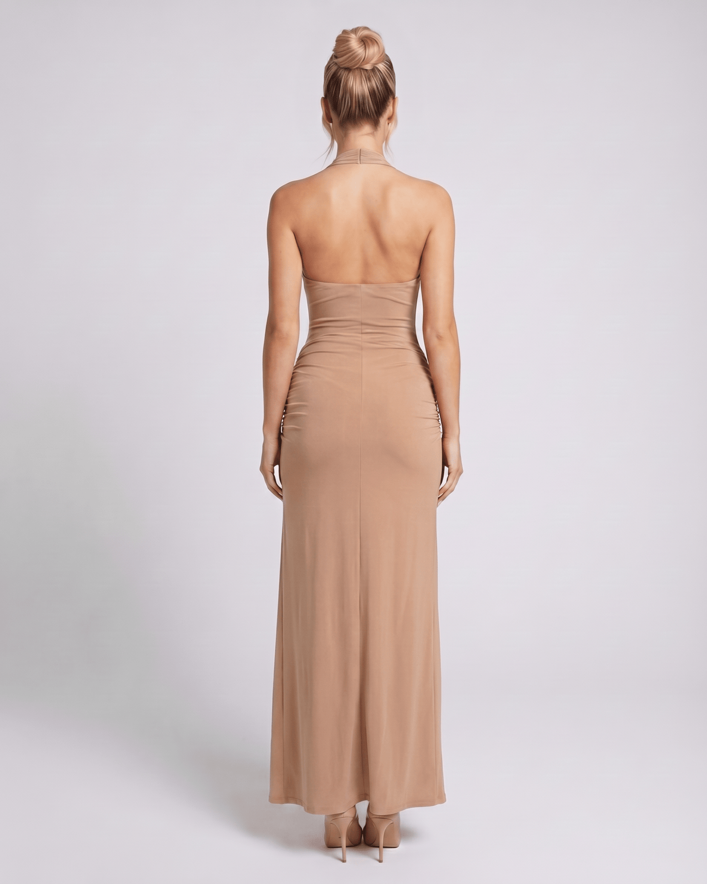 Back view of the Zarelle Maxi Dress, a camel maxi dress featuring stretch jersey fabric and a sleek silhouette by Lauven.