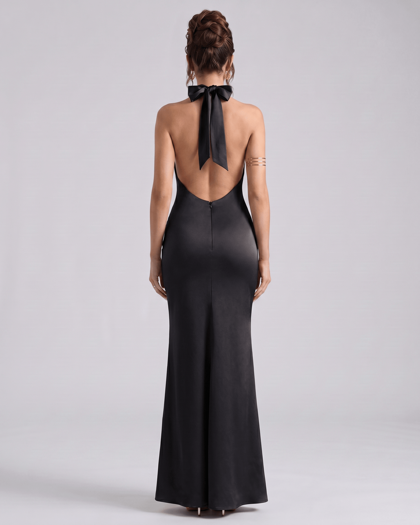 Zerelle Maxi Dress in black, featuring a smooth polyester fabric, halter neckline, and elegant ruffle details by Lauven.